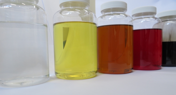 Oils with different colors in sample cups