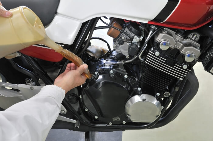 Top up engine oil in a motorcycle