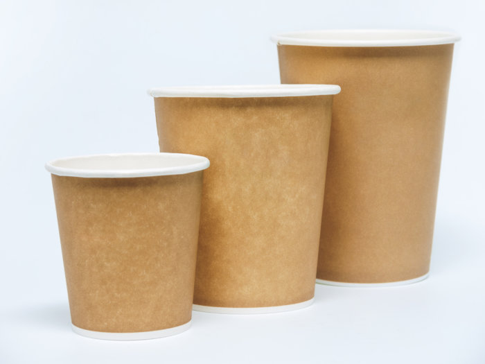 A row of cardboard-based coffee cups