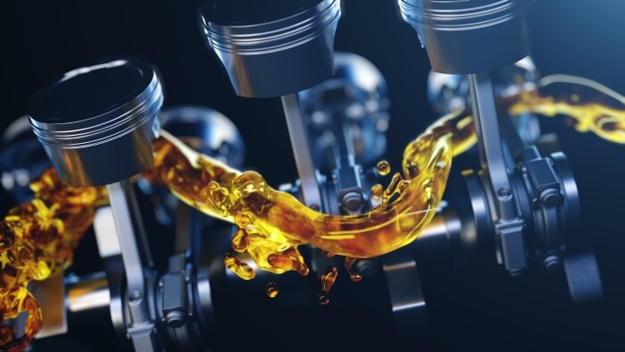 What is the function of engine oil in a combustion engine?